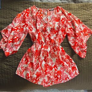 Coral reef patterned romper with half flutter sleeves and waist cinch. Size M.